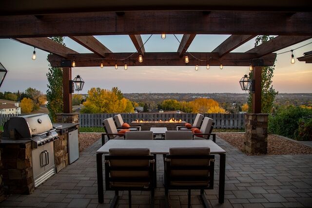 Backyard patio with the perfect barbeque and seating arrangement for a party